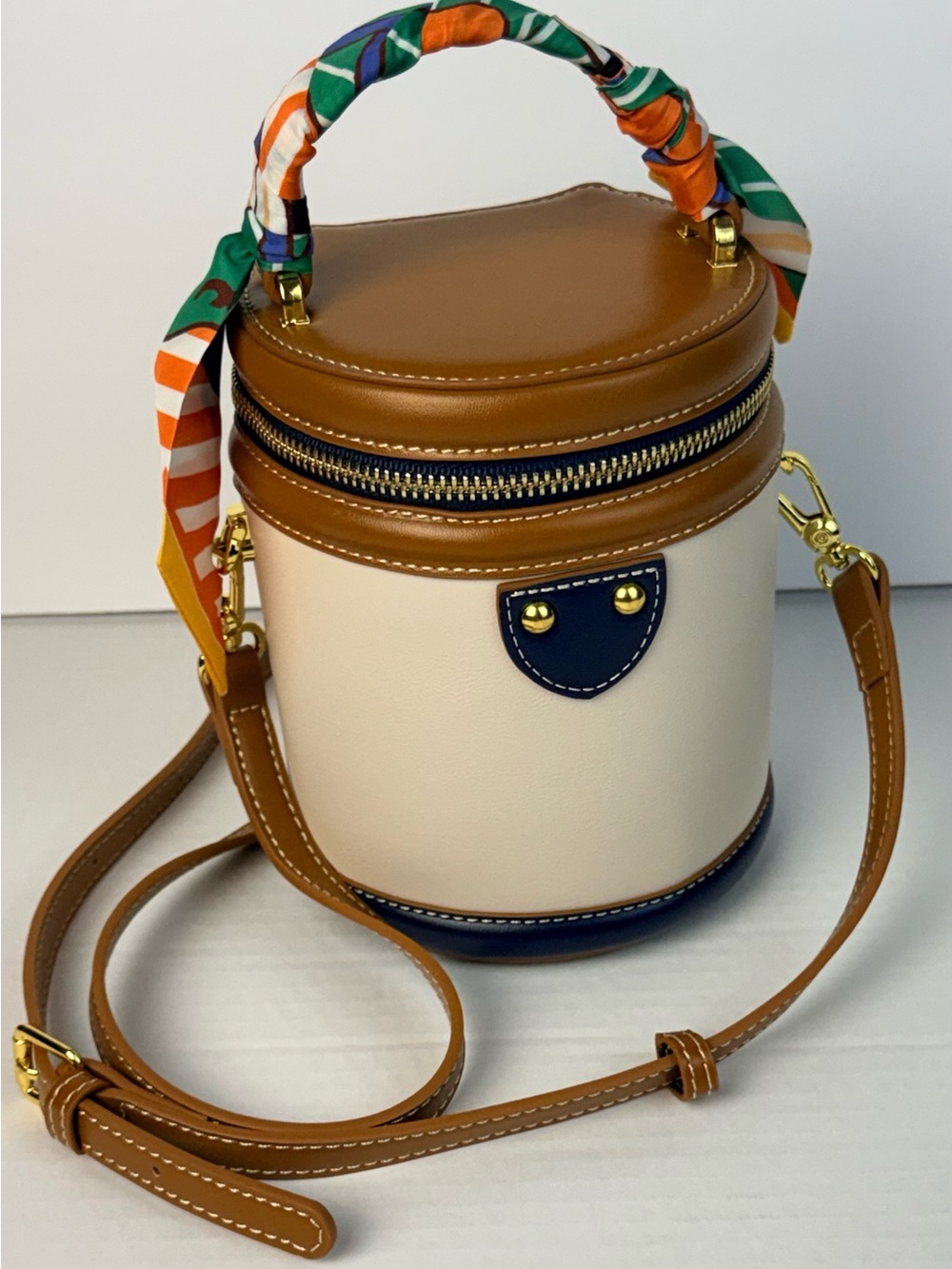 Cream & Tan Cylinder Crossbody Bag with Navy Accents